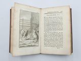 an open book with a picture of a dog and a cat on it