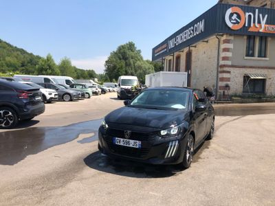 a black car parked in front of a building