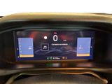 the dashboard of a car with a digital display on it