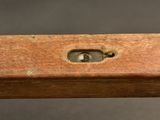 an old wooden table with a metal latch on it