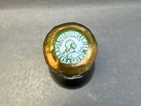 a close up of a bottle of beer on a table