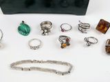 an assortment of jewelry including rings, bracelets, rings, and necklaces