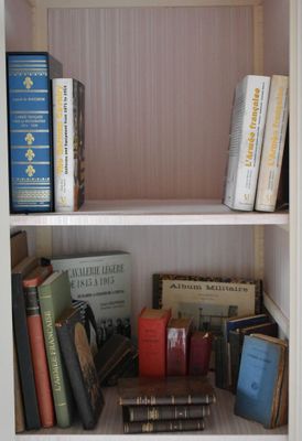 a book shelf with many books on top of it