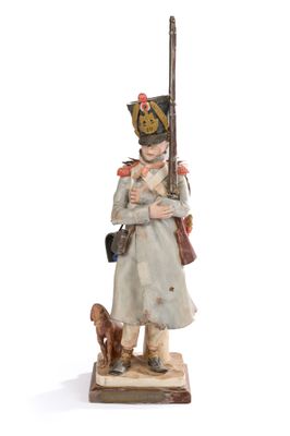 figurine représentant un soldat muni d'un fusil et accompagné d'un chien, sur fond blanc