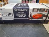 a box of a battery hedge trimmer sitting on top of a table