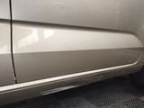 a close up of a car ' s door handle and door handle