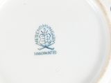 a white plate with a blue and white design on it