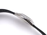 the black leather bracelet has a silver clasp on it