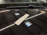 a parking ticket on the windshield of a car
