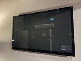 a flat screen tv mounted on a wall in a living room