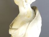 marble bust of a woman on a gold stand