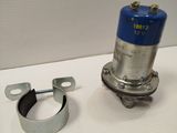 a small metal object on a table next to a couple of clamps