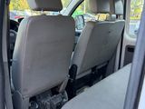 two seats in the back of a white van