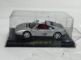 a silver car in a glass case on a black base