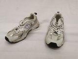 pair of new balance shoes on a white surface