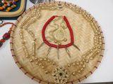 a picture of a basket with a necklace and bracelets on it