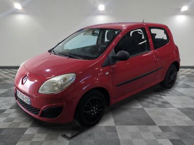 a picture of a red car parked on a checkered floor