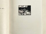 an open book with a picture of a man sitting on a bench