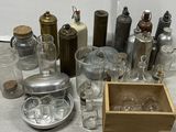 a lot of glass bottles and containers on the floor