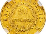 a close up of a gold coin on a white background