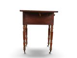 an old wooden table with a drawer on top of it
