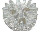 a glass candle holder with two candles inside of it