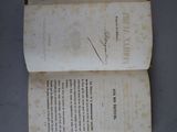 a book with writing on it sitting on a table