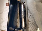 a metal pipe that is sitting in a box