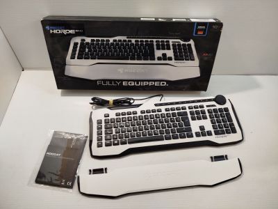 a computer keyboard and mouse sitting on a table