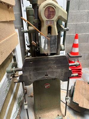 a machine that is sitting on the side of a building