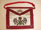 a red and white bag with a bird on it