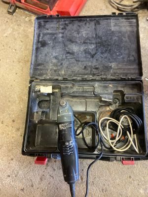a tool in the case that is sitting on the floor