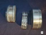 three different types of wedding rings on a table