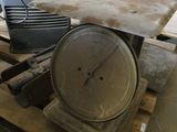 a large metal pan sitting on top of a wooden pallet
