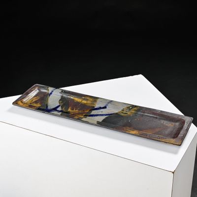 a glass plate on a white box on a black background
