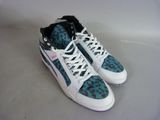 leopard print high top sneakers with black laces on a white surface
