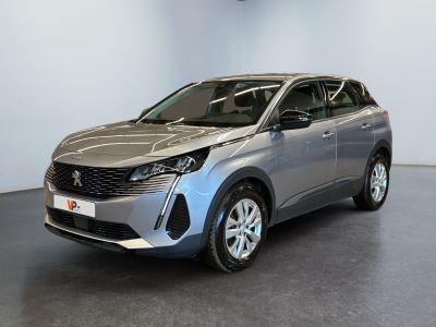a silver car is parked in a room with a black floor