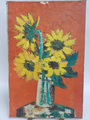 un tableau représentant des tournesols dans un vase, posé sur un chevalet