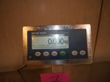a picture of a digital scale with a sticker on it