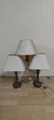 two lamps that are sitting on the floor next to each other