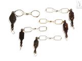 five different types of fishing lures on a white surface