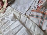 many different types of clothing laid out on a bed