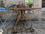 a table with a basket on top of it on a patio