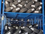 two crates of tires that are stacked on top of each other