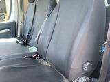 a black seat in the back of a white van