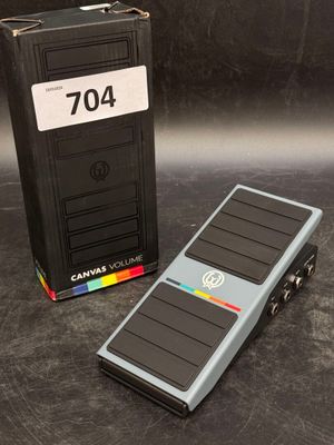a pedal pedal sitting next to a box with a clock on it