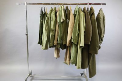 a rack with a bunch of shirts hanging on it