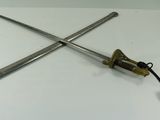 two swords that are laying on a table