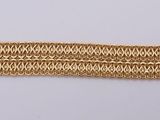 a close up of a gold bracelet with a chain on it