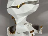 a close up of a paper sculpture of a dog on a table